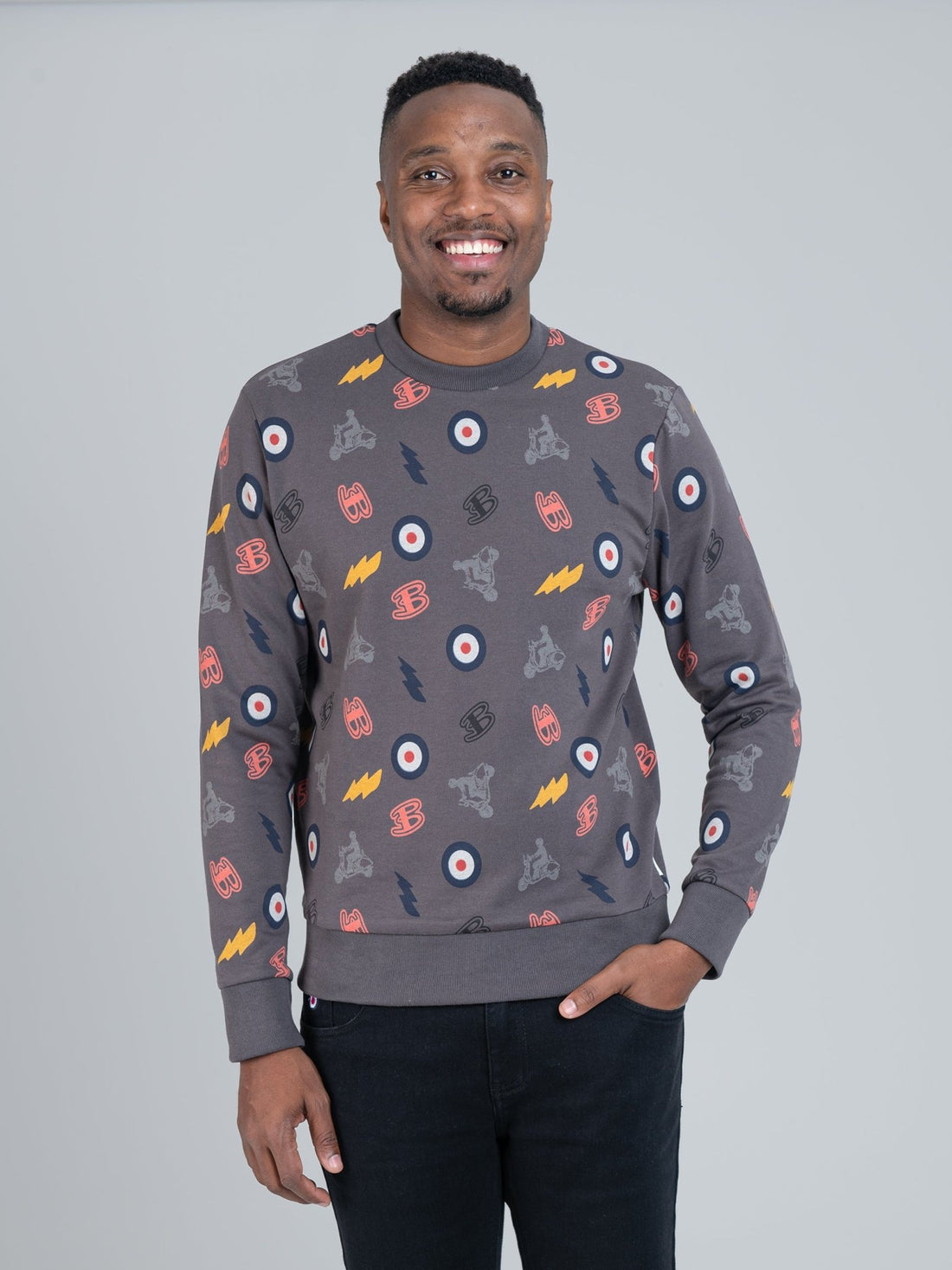 Ben Sherman All-Over Print Crew Sweater in charcoal, worn by a male model, featuring bold all-over graphic print design