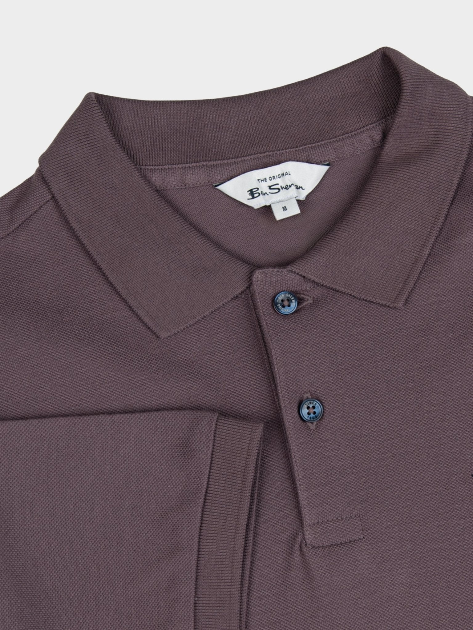 Ben Sherman cotton pique polo in Cocoa Powder, close-up detail of the flat knit collar, two-button placket and branded neck label