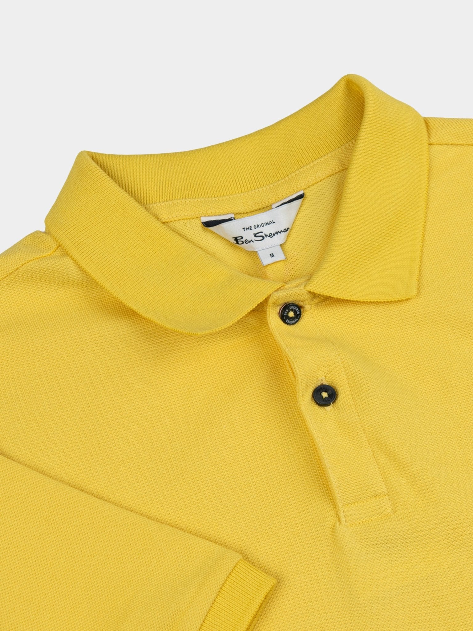 Ben Sherman Ben Polo in Oasis Yellow, close-up detail of collar and two-button fastening