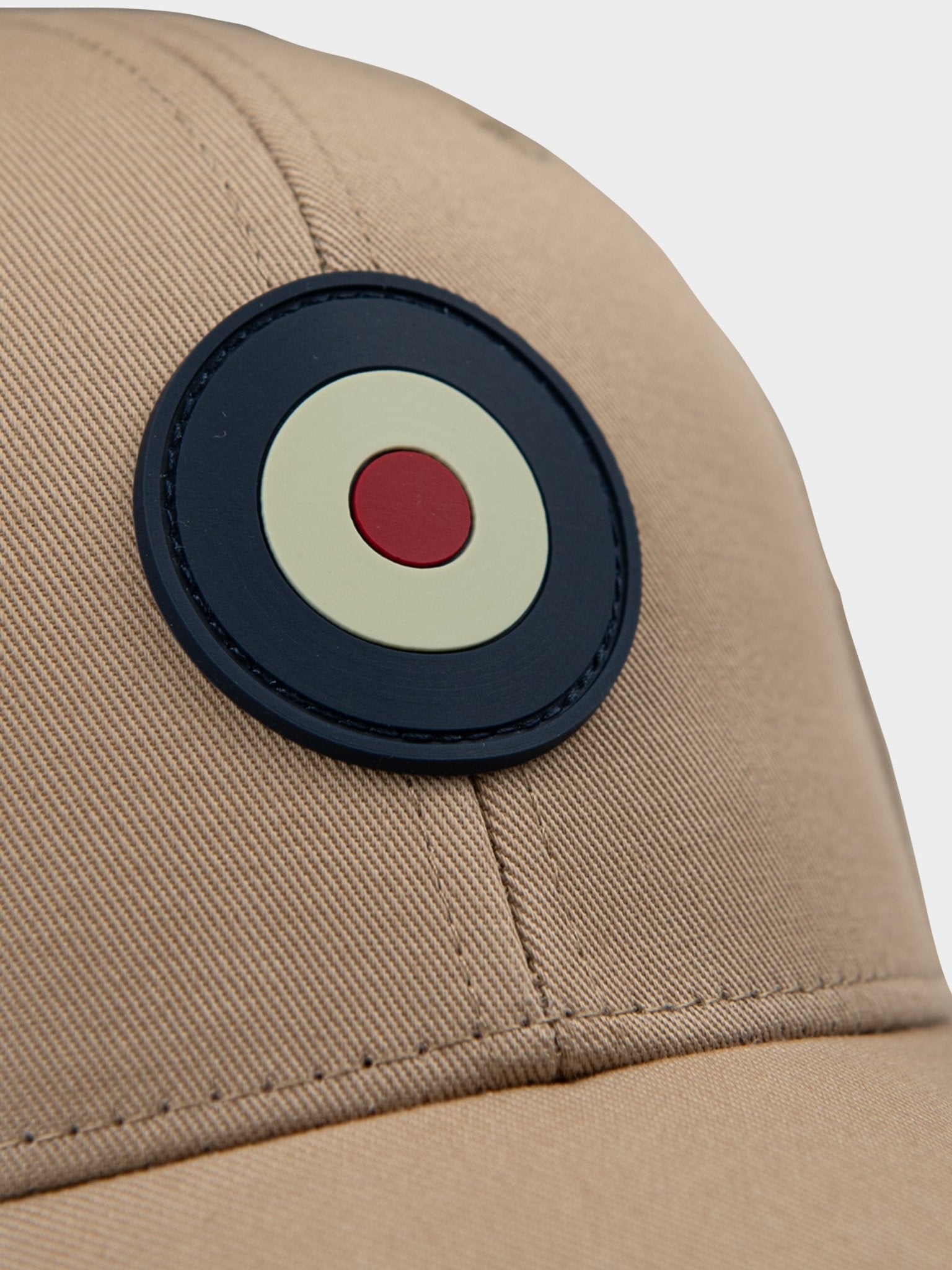 Close-up of rubberized Ben Sherman Target emblem on Adult Targy Peak Cap in Cornstalk
