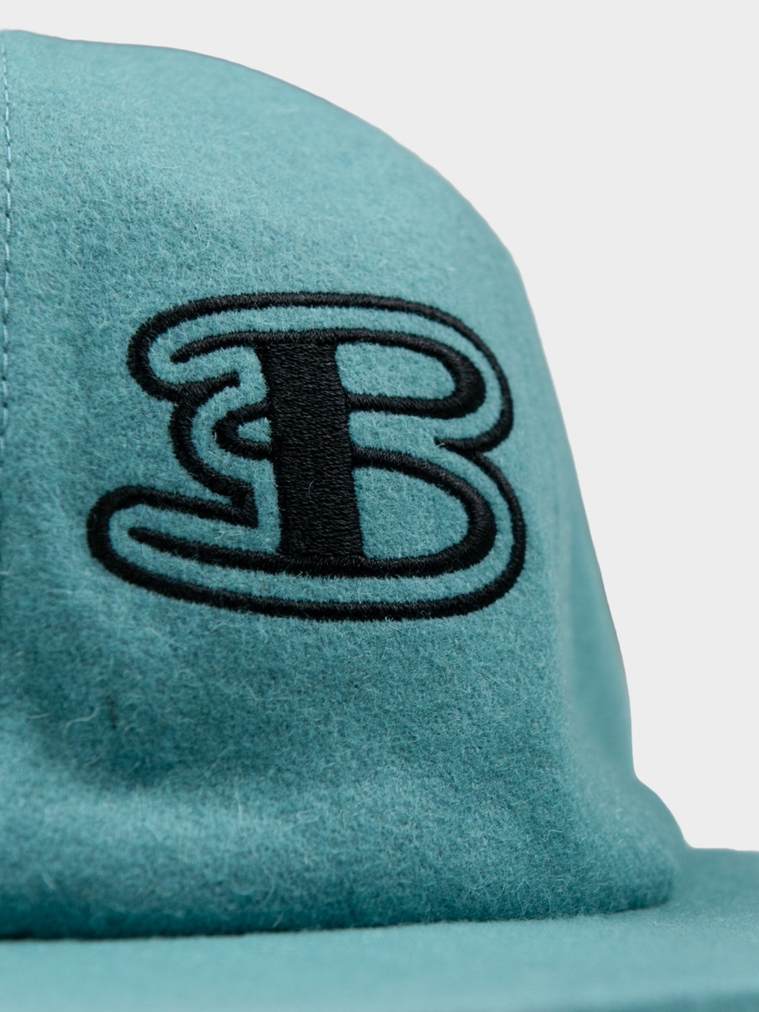 Interior view of Ben Sherman Preppy Wool Blend Cap in Aqua Teal showing Union Jack lining detail