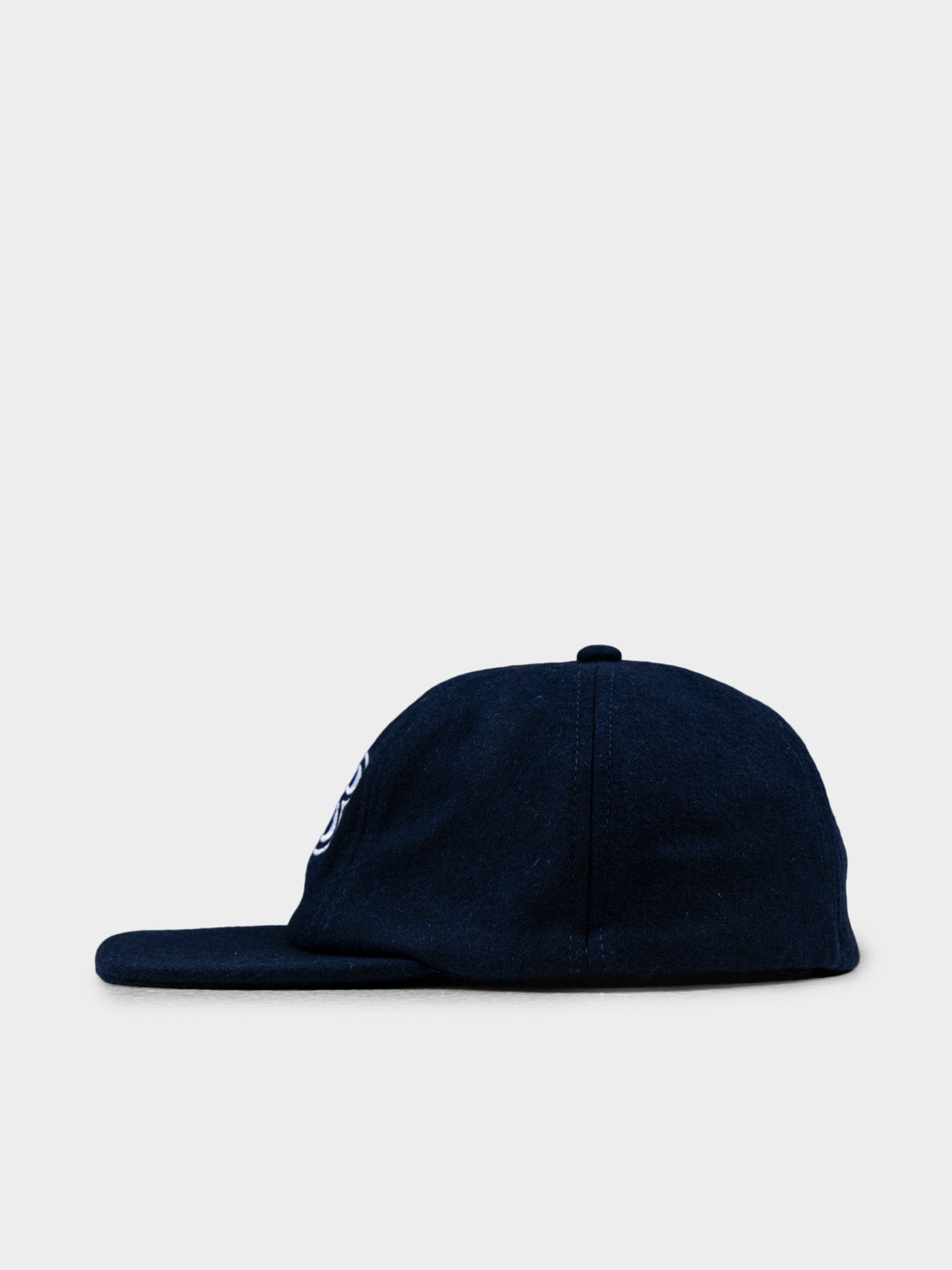 Side view of Ben Sherman Preppy Wool Blend Cap in Navy showing curved brim and wool texture