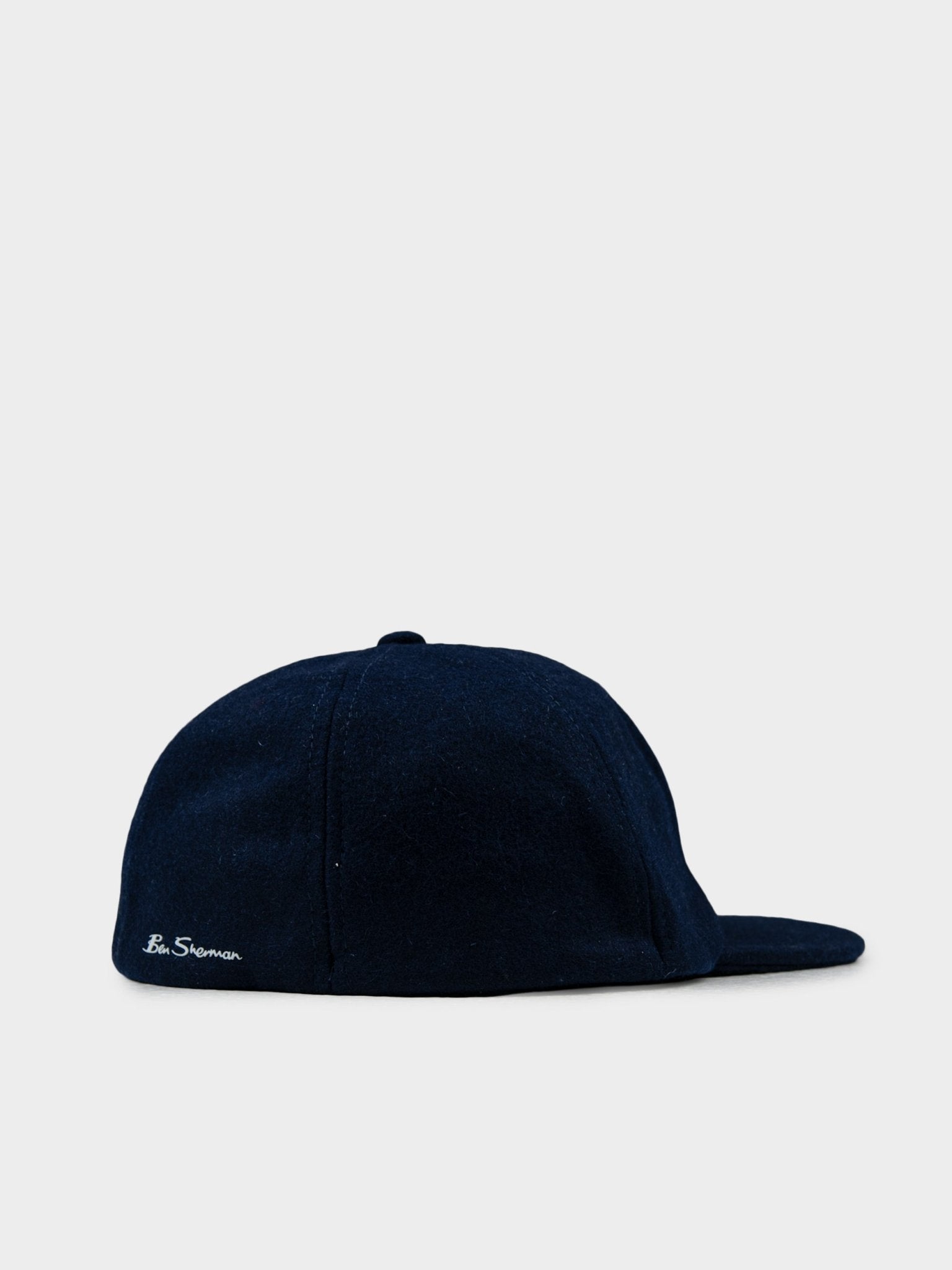 Back view of Ben Sherman Preppy Wool Blend Cap in Navy featuring hook-and-loop adjustable closure