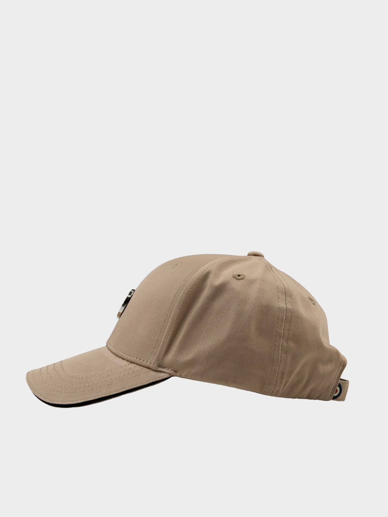 Side view of Ben Sherman Metal Target Badge Cap in Cornstalk showing structured crown and curved visor