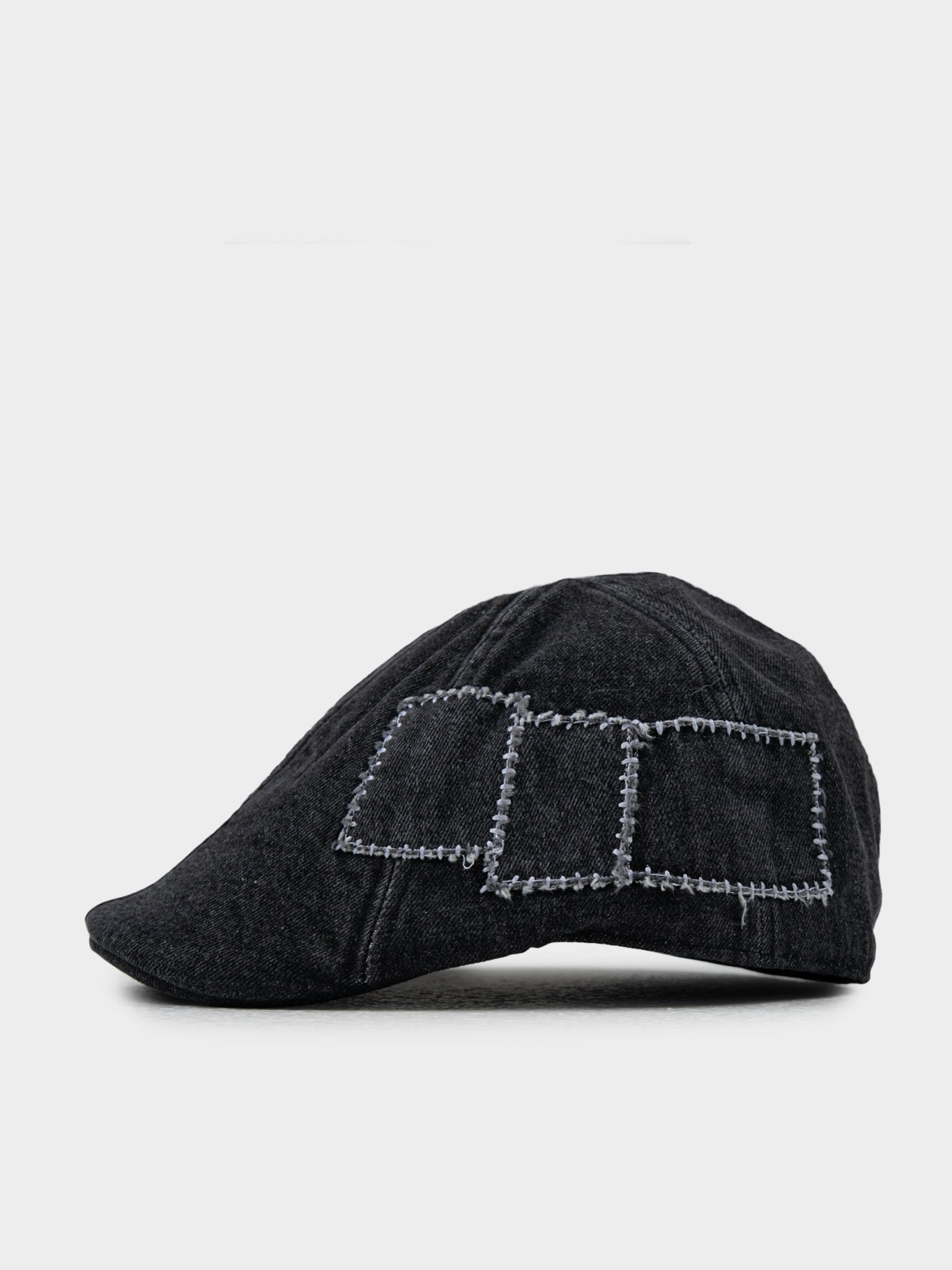 Side view of Ben Sherman Denim Dixie Cap in Black showing textured denim patchwork detail