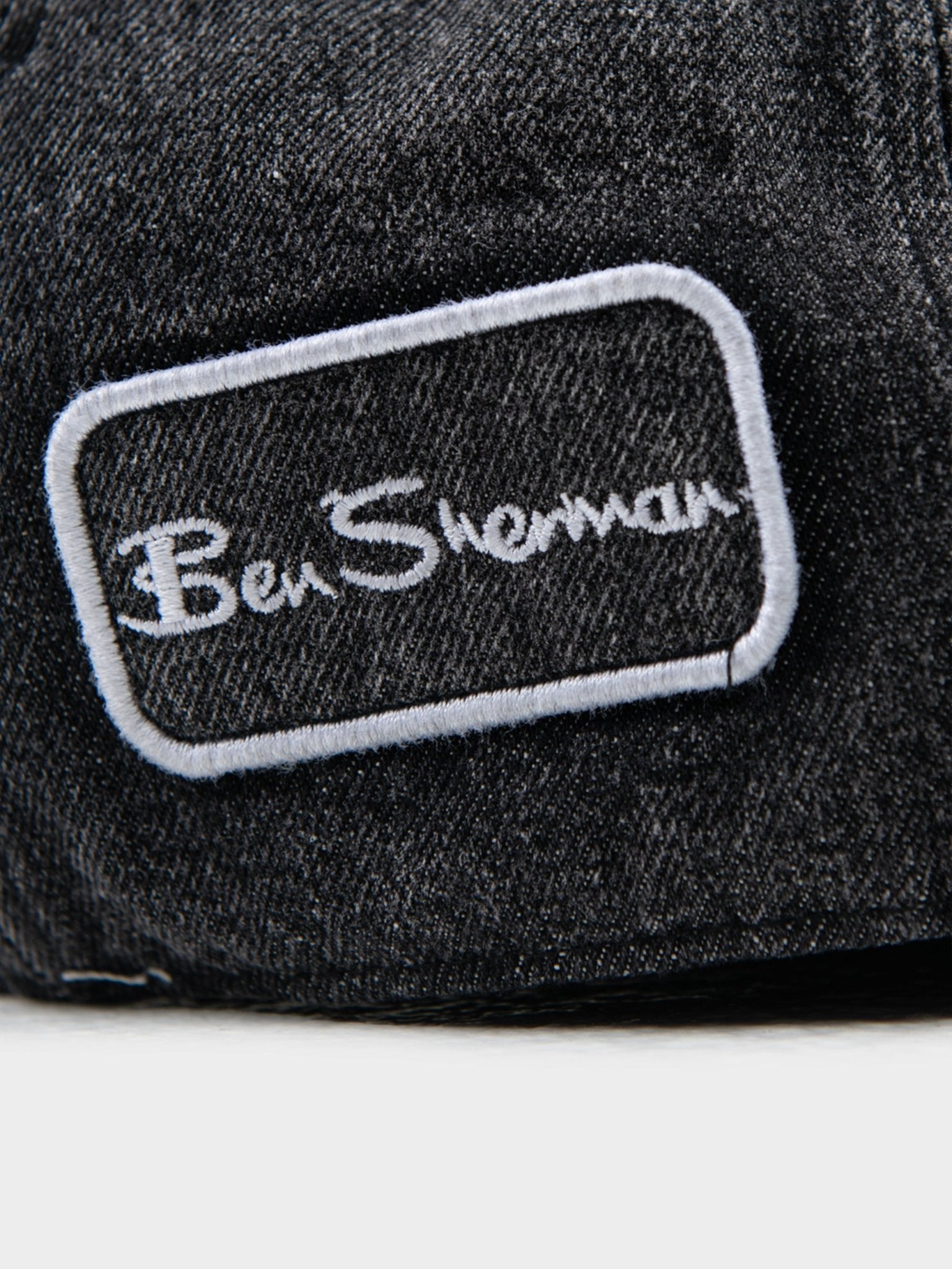 Close-up of embroidered Ben Sherman signature logo on Denim Dixie Cap in Charcoal