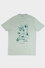 Flat lay of a pistachio green Ben Sherman t-shirt featuring a retro sketched Mod Zone print with a scooter, helmet, guitar, camera, and seagull illustrations.