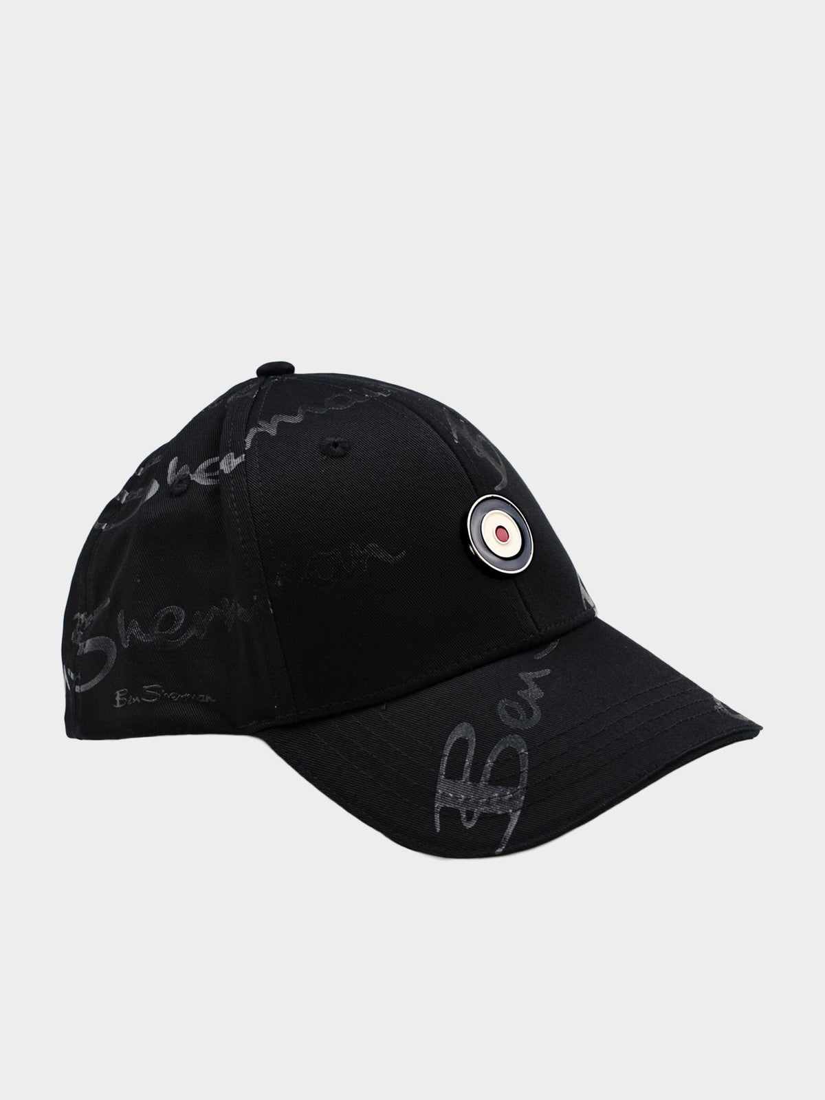 Ben Sherman George Plastisol Cap in Black - all-over signature print baseball cap with target badge and snapback closure