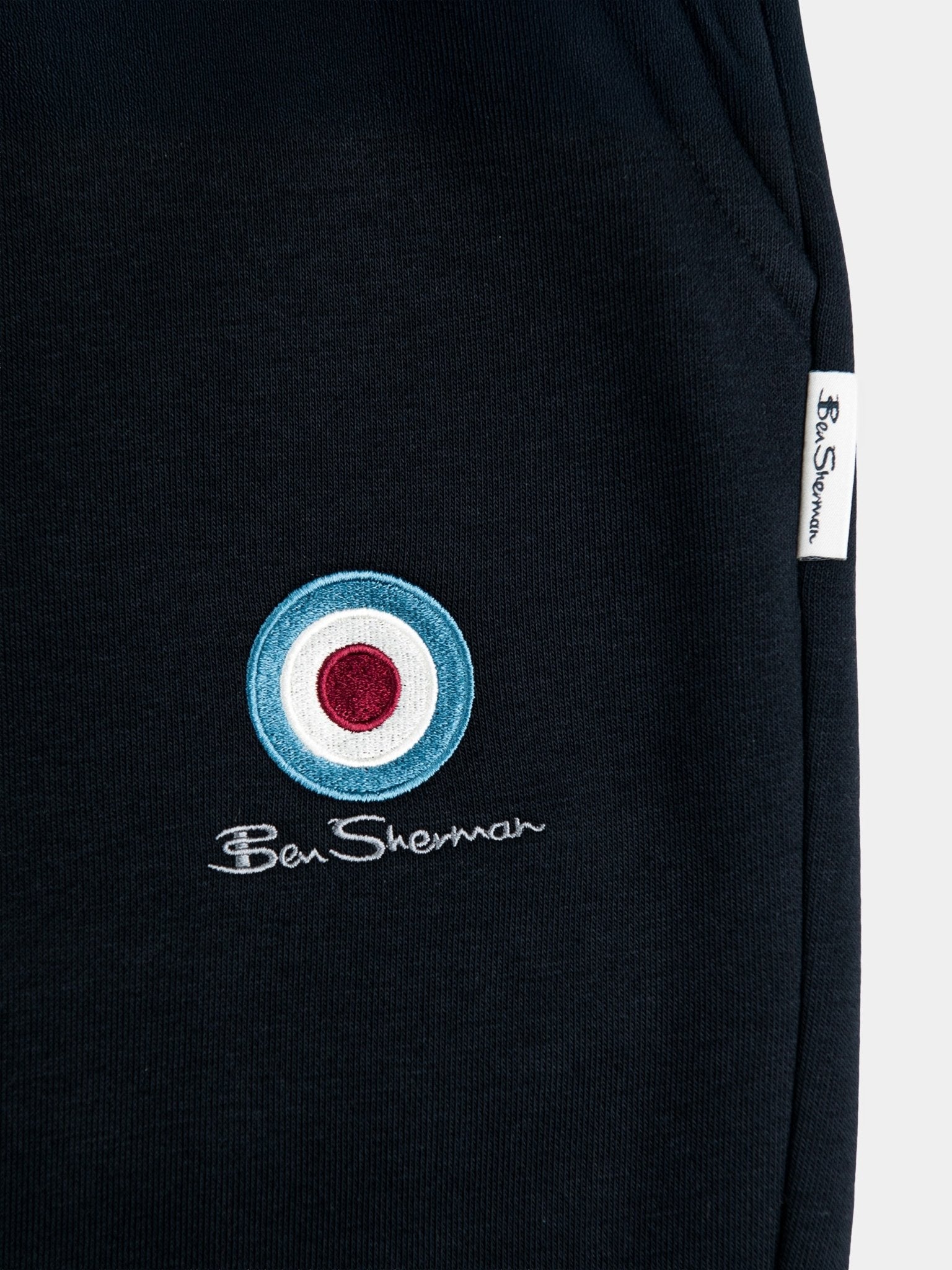 Ben Sherman Target Jogger Shorts Black – close-up of iconic target emblem and drawcord waistband detail