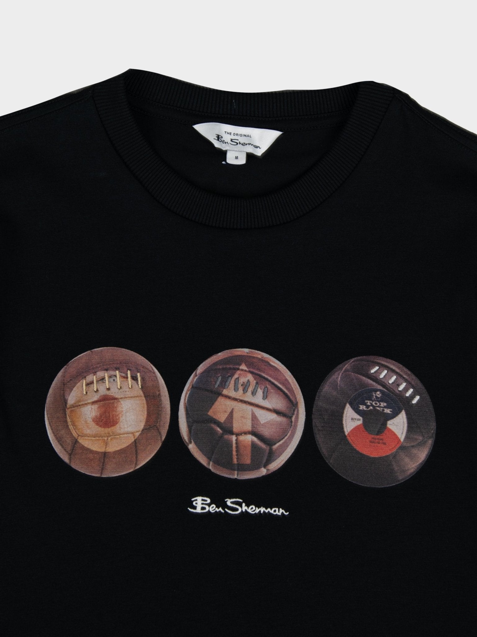 Close-up of Ben Sherman 3 Ball Tee chest graphic in Black – three mod-inspired ball motifs with Ben Sherman branding on black cotton fabric