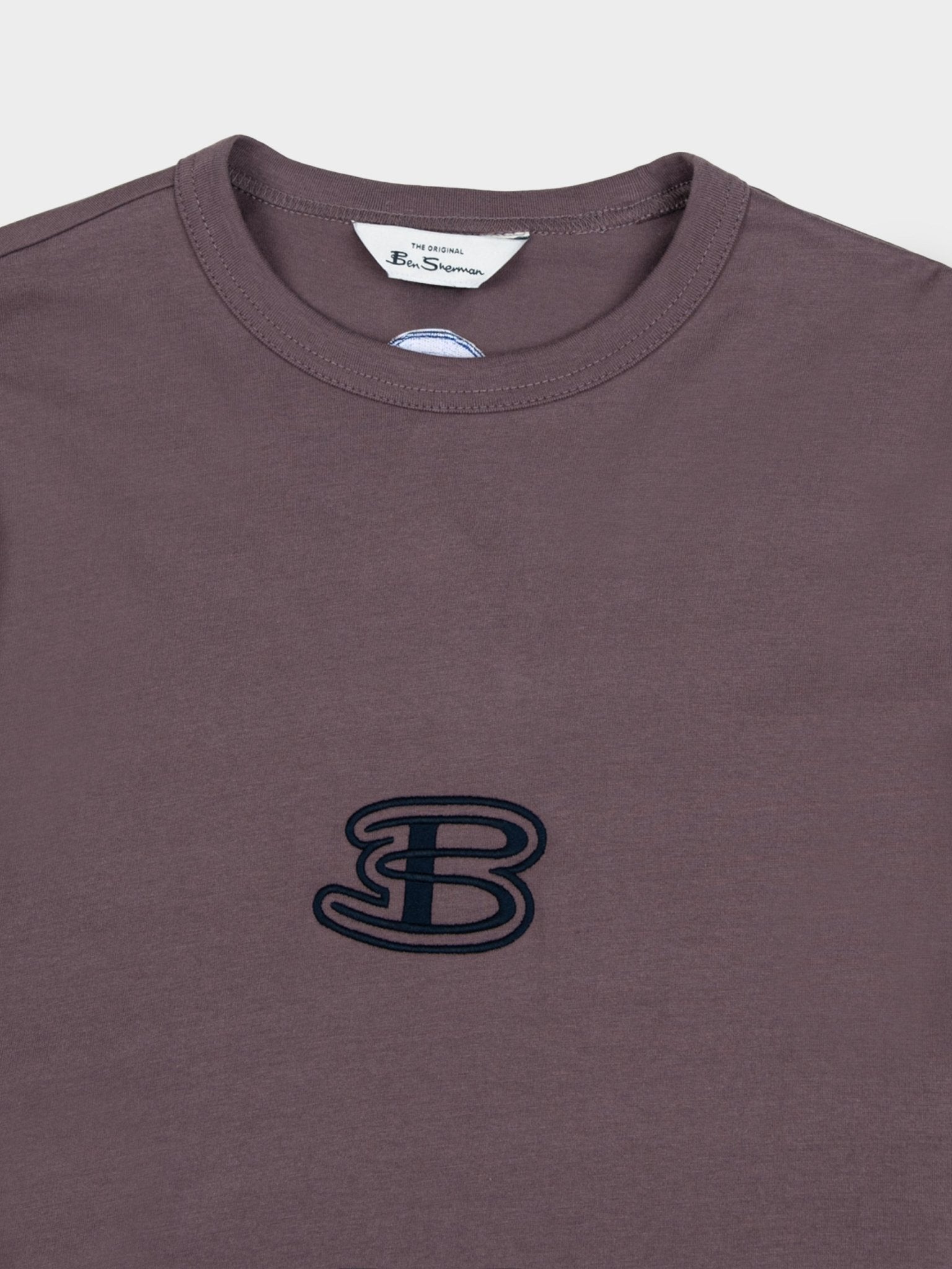 Close-up of Ben Sherman Athleisure Tee in Cocoa Powder – embroidered B logo detail and contrast stripe sleeve on cotton men's t-shirt