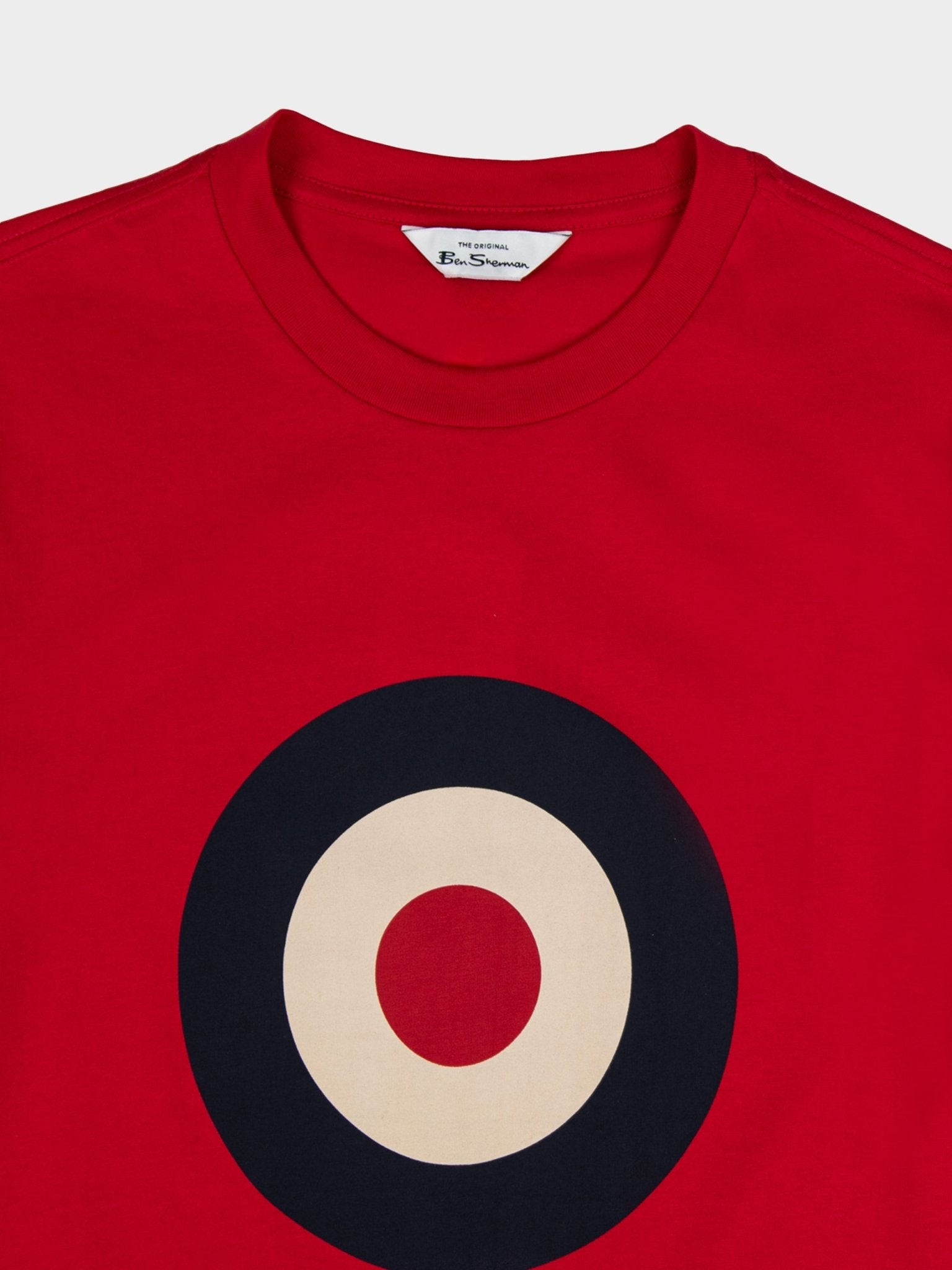 Ben Sherman Target Tee in Red - close-up of the signature target roundel print and Ben Sherman label on short-sleeve crewneck tee