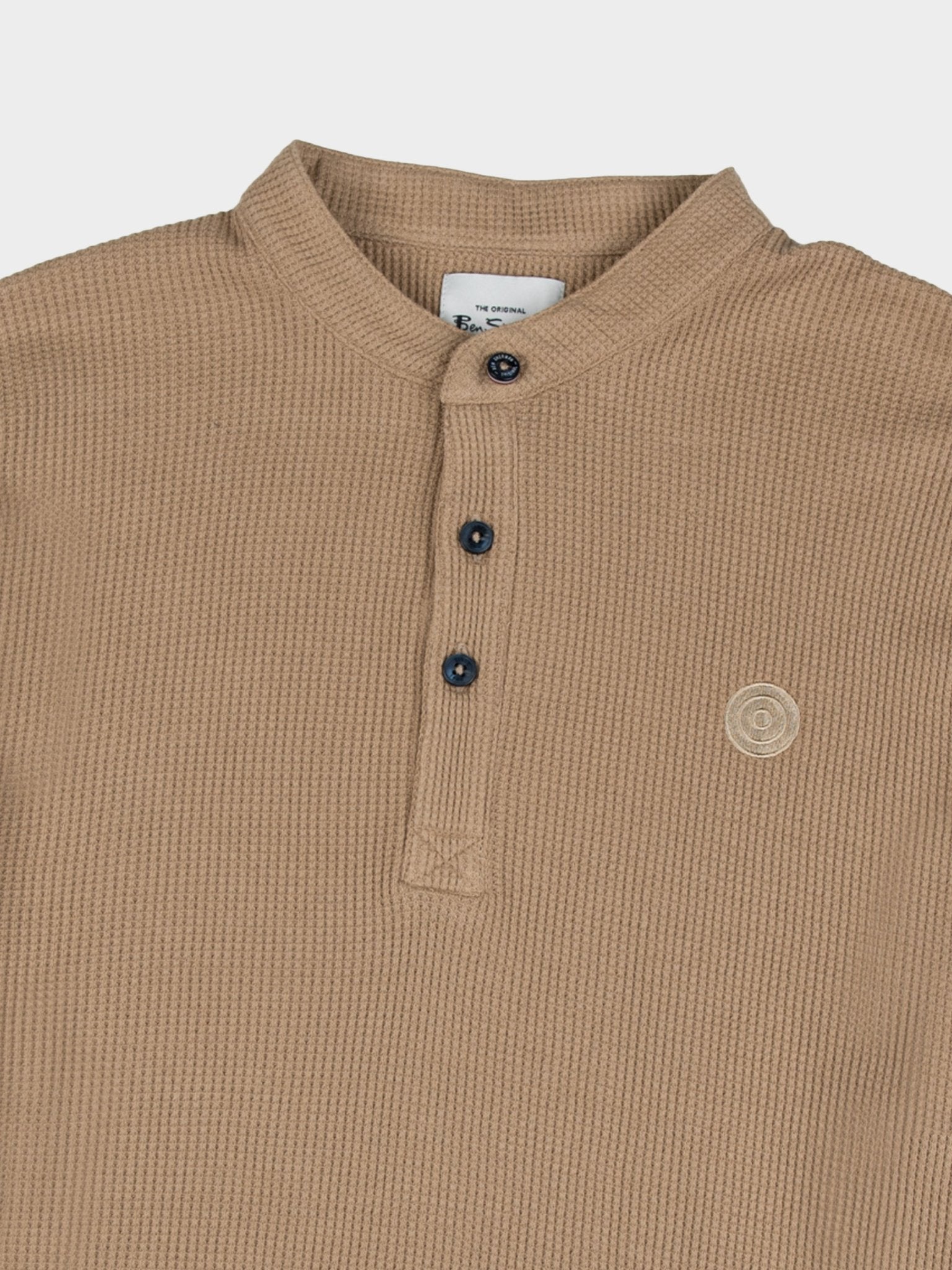Close-up detail of Ben Sherman WKNT4000 Henley Long Sleeve Waffle Knit in Cornstalk – waffle knit texture, button henley placket and tonal Ben Sherman logo detail