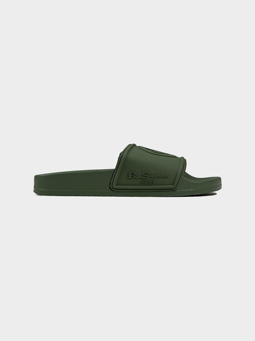 Ben Sherman Target Embossed Slides in Olive - Men's slip-on sandal with contoured footbed and embossed logo strap, side profile view